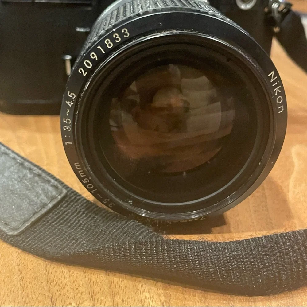 Vintage Nikon FM2 black camera with lens